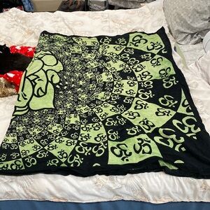 Cotton wall tapestry. Made in India. Hand wash. Hanging holes in 2 corners